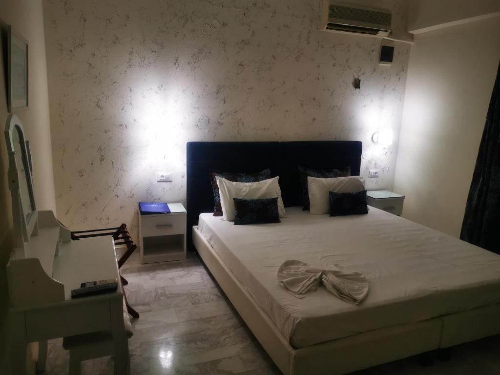 Postel nebo postele na pokoji v ubytování Vlycha Beach Apartments