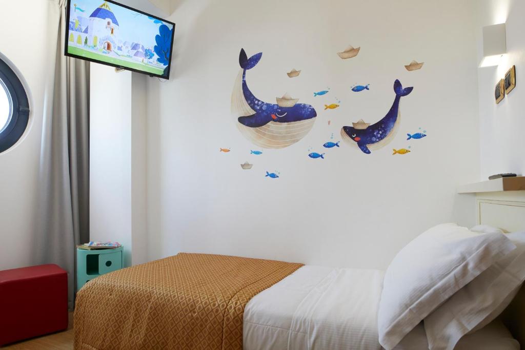 Postel nebo postele na pokoji v ubytování Termini Beach Hotel & Suites
