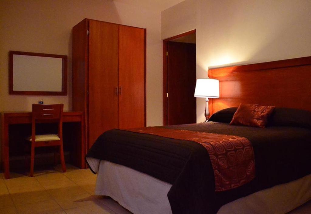 Postel nebo postele na pokoji v ubytování Hotel Marllou
