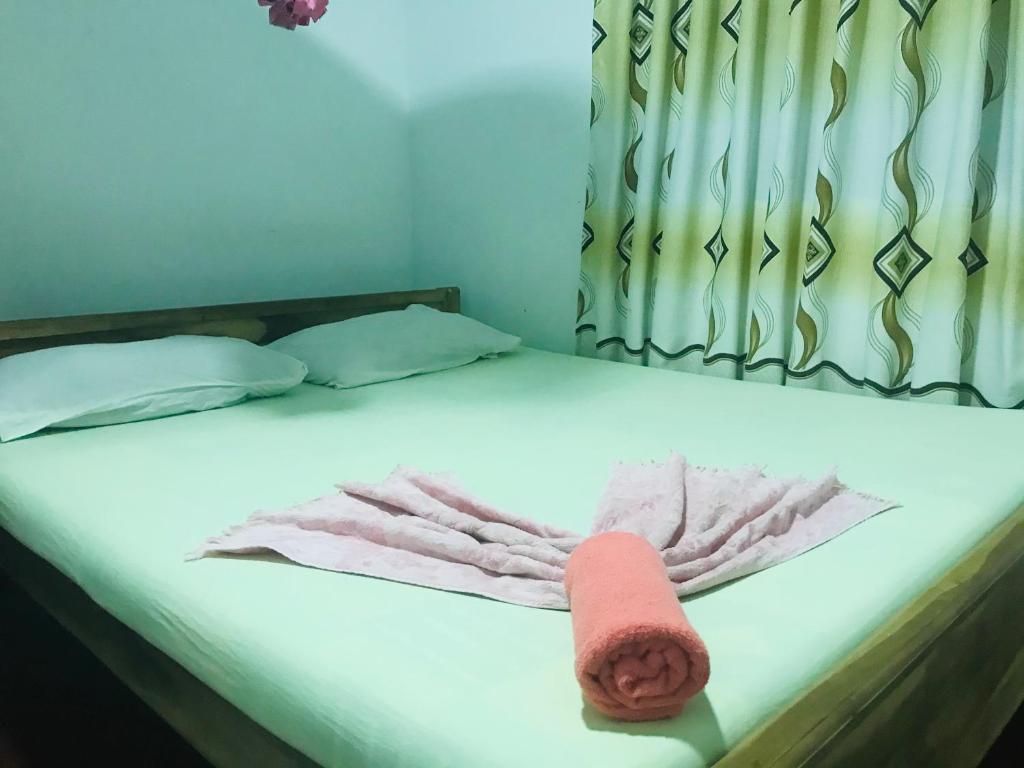 Postel nebo postele na pokoji v ubytování Akila's Hideaway