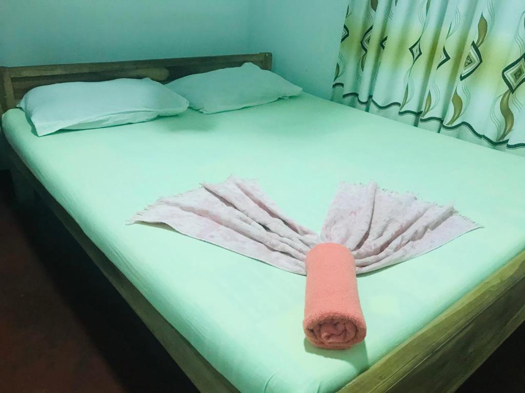 Postel nebo postele na pokoji v ubytování Akila's Hideaway