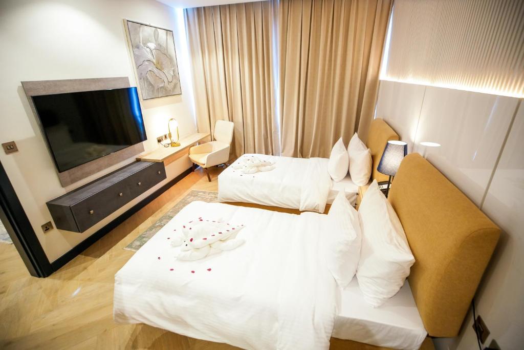 Postel nebo postele na pokoji v ubytování Royal Mansoura Residence Hotel