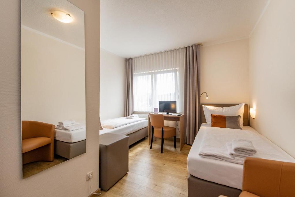 Letto o letti in una camera di Hotel Bamberger Hof, garni