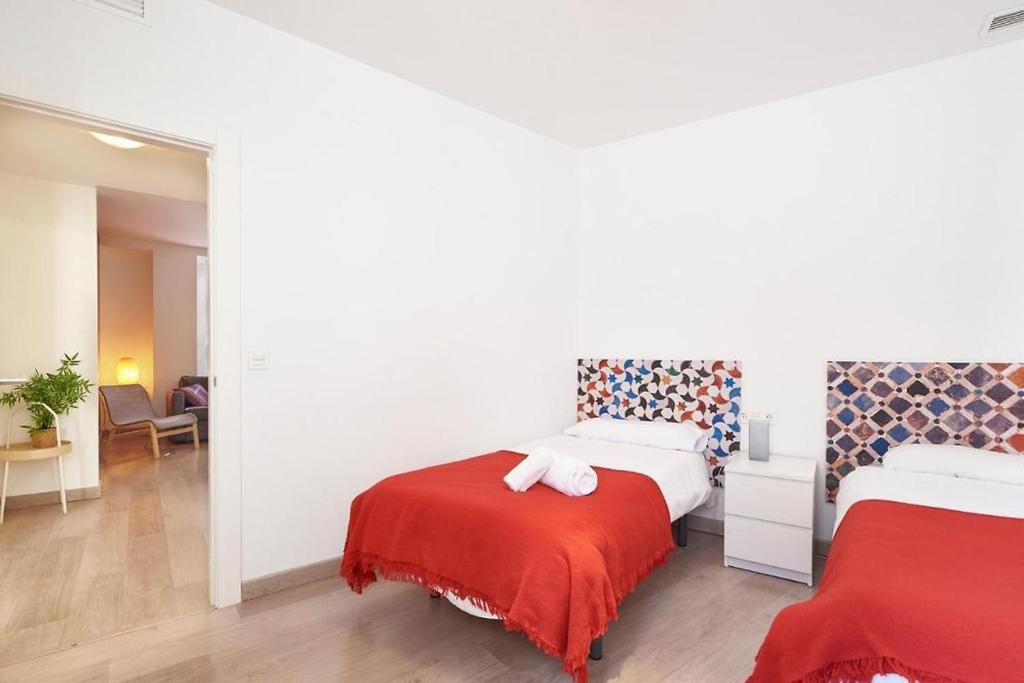 A bed or beds in a room at Apartamento ideal para familias en Granada