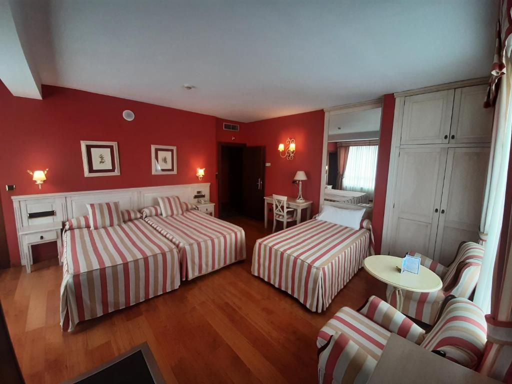 Postel nebo postele na pokoji v ubytování Hotel Leonor Mirón