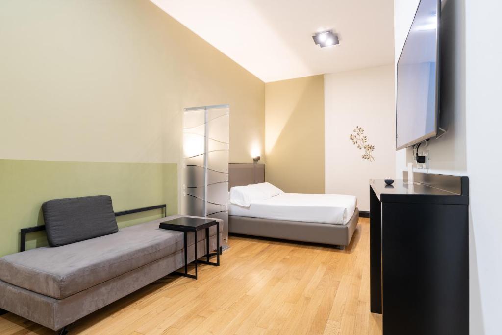 Postel nebo postele na pokoji v ubytování Castello Guest House Milano