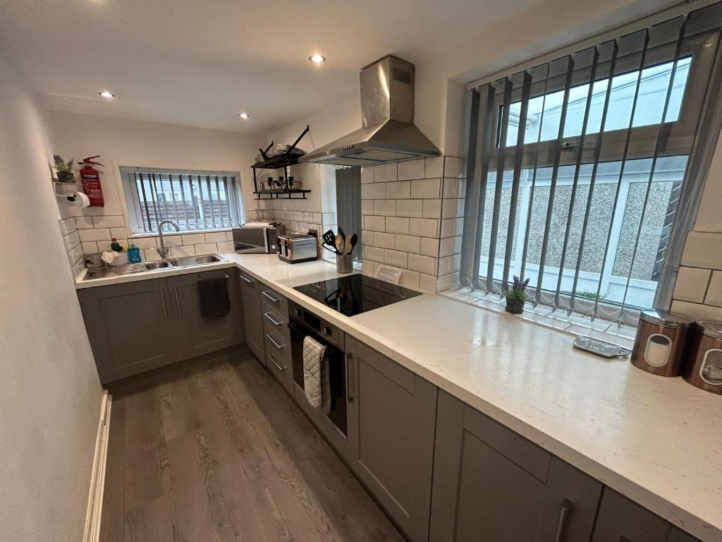 a kitchen with a sink and a counter top at The Bungalow, Thornton-Cleveleys in Cleveleys