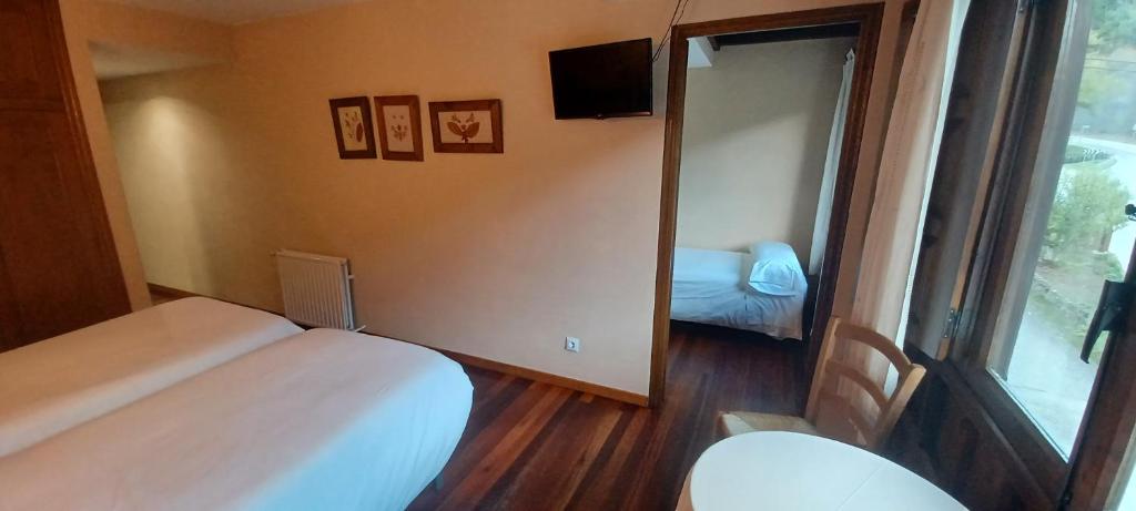 Postel nebo postele na pokoji v ubytování El Caserío