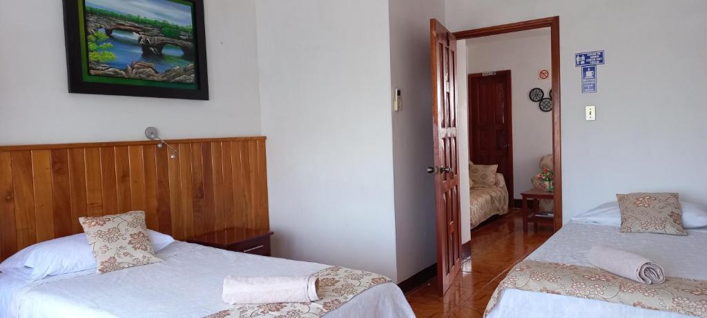 Postel nebo postele na pokoji v ubytování Hotel Sula Sula