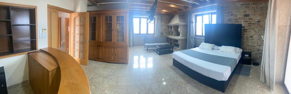 A bed or beds in a room at Hotel Rural Finca Aldeola