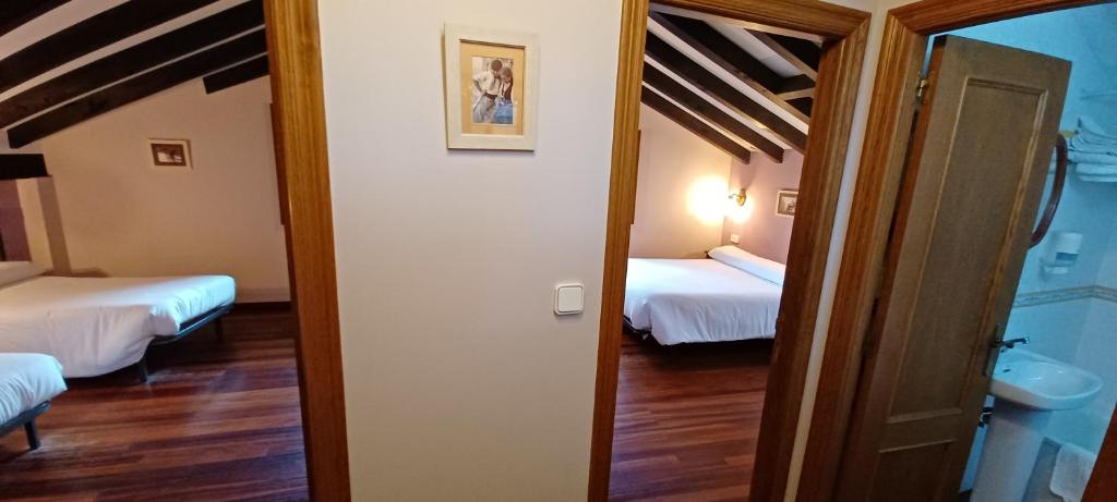 Postel nebo postele na pokoji v ubytování El Caserío