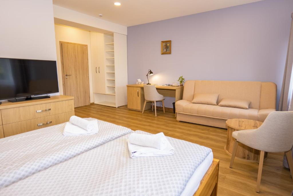 Postel nebo postele na pokoji v ubytování Penzion Harmony Javorník