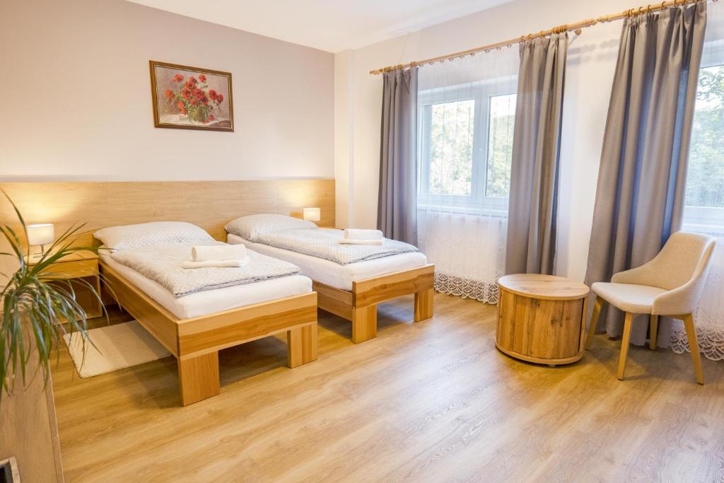 Postel nebo postele na pokoji v ubytování Penzion Harmony Javorník