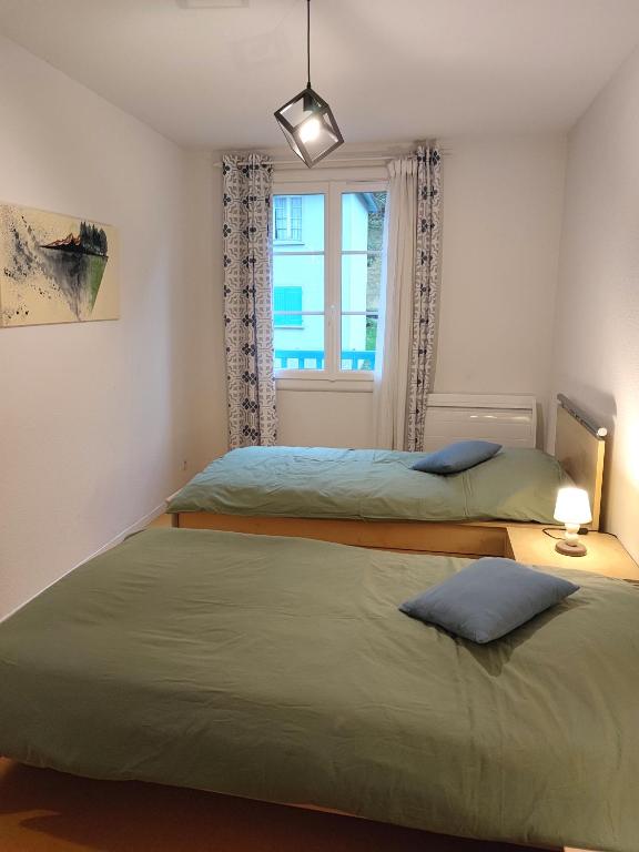 Posteľ alebo postele v izbe v ubytovaní Grand appartement en RDC Vallée de Campan