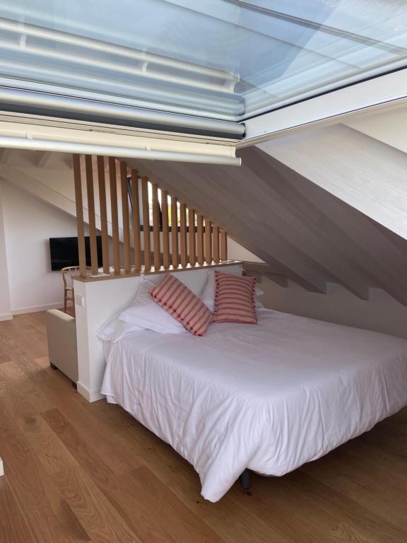Posteľ alebo postele v izbe v ubytovaní Apartamentos Boutique Aroca