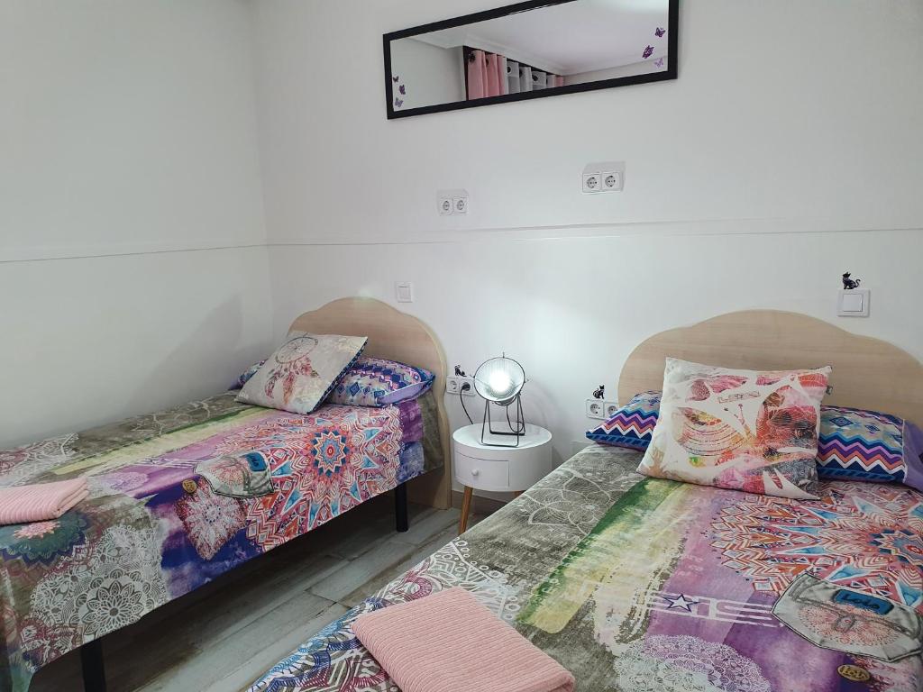 Postel nebo postele na pokoji v ubytování Albergue Piedad