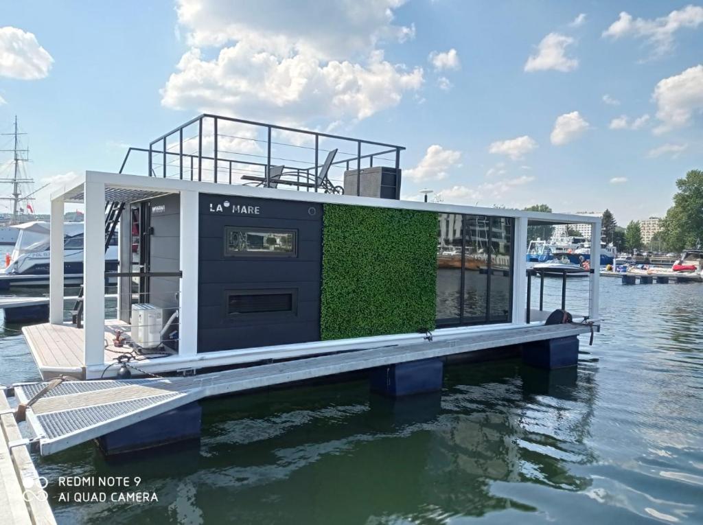 a house on a dock in the water at La Mare Boathouse, Tallinn in Tallinn