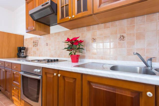 Kuchyň nebo kuchyňský kout v ubytování Apartmani Lucia