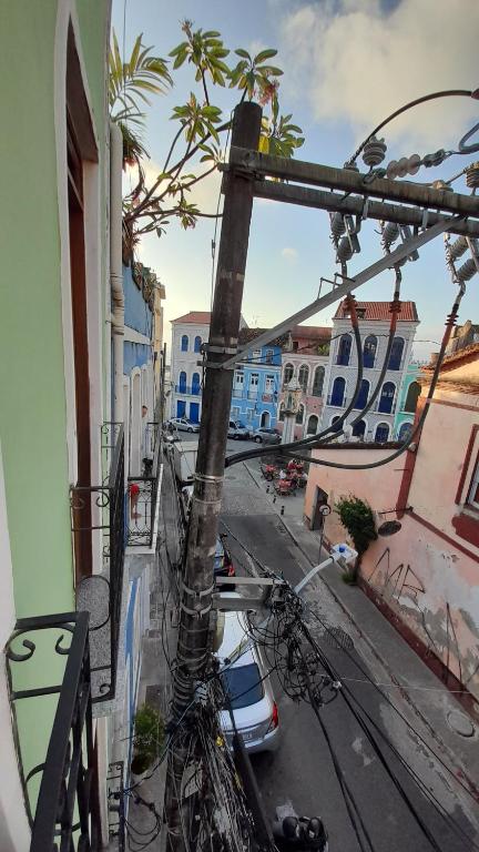 a view of a street with a tree on a building at Casa Almeida in Salvador