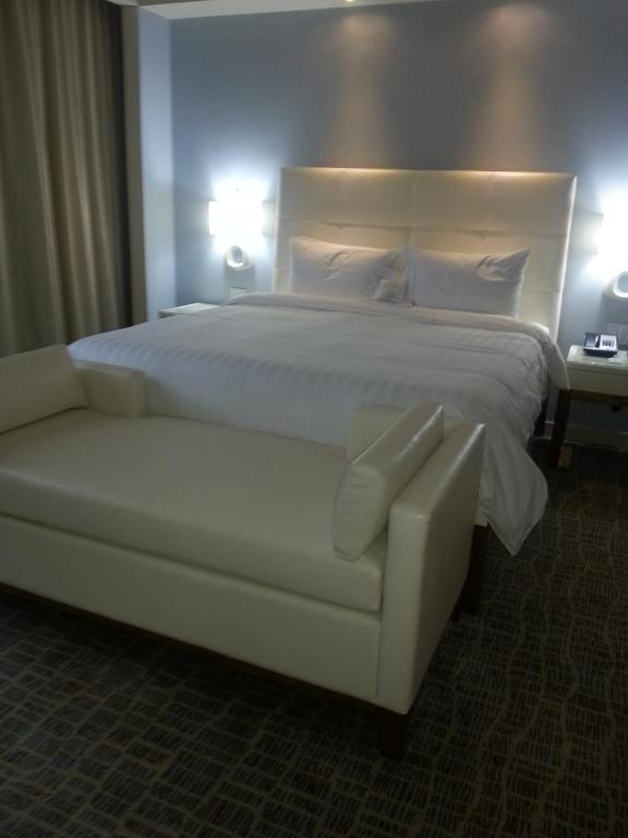 Postel nebo postele na pokoji v ubytování Global Hotel Panama