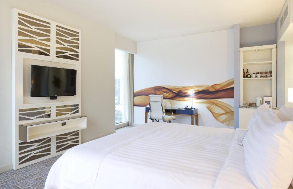 Postel nebo postele na pokoji v ubytování Global Hotel Panama