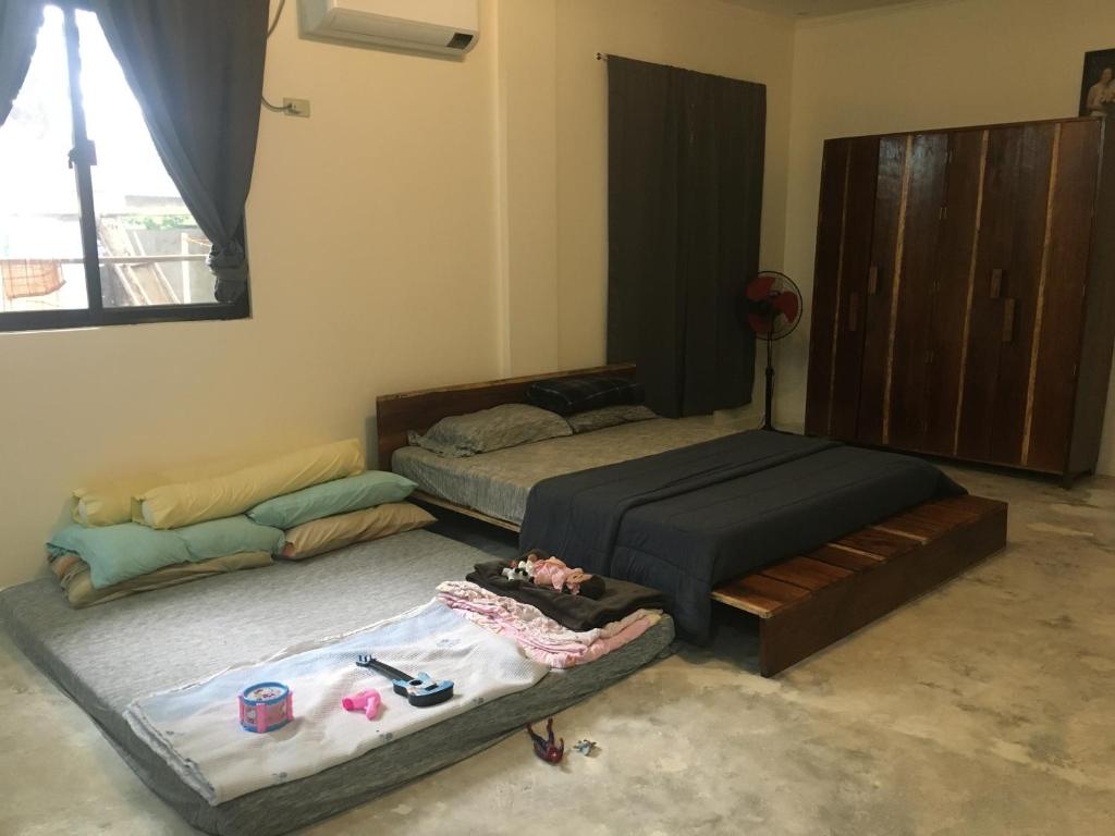 En eller flere senge i et værelse på Kim's Guesthouse