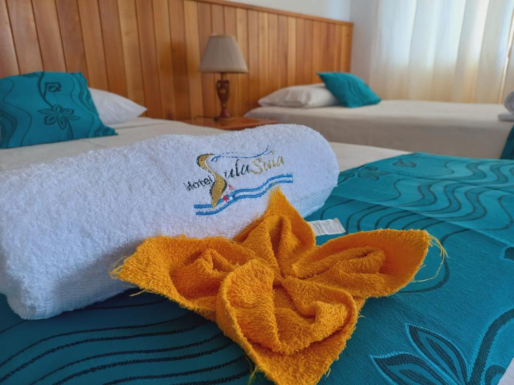 Postel nebo postele na pokoji v ubytování Hotel Sula Sula