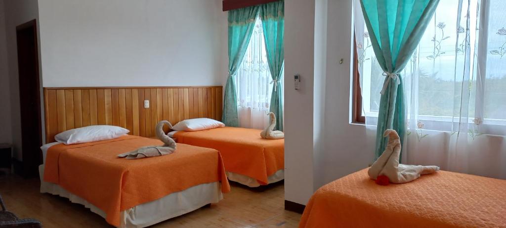 Postel nebo postele na pokoji v ubytování Hotel Sula Sula