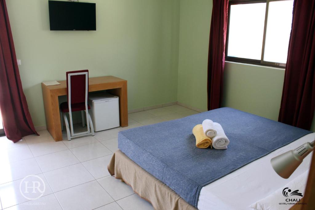 Postel nebo postele na pokoji v ubytování Hotel Roterdão "Under New Management"