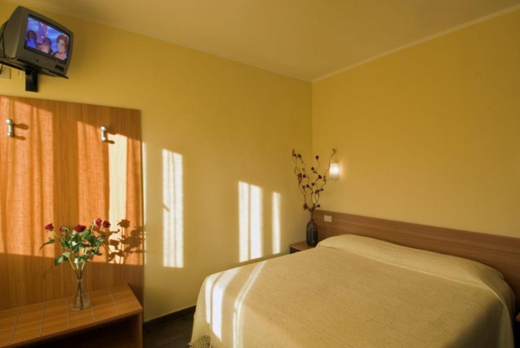 Postel nebo postele na pokoji v ubytování Hotel Il Cavaliere Nero