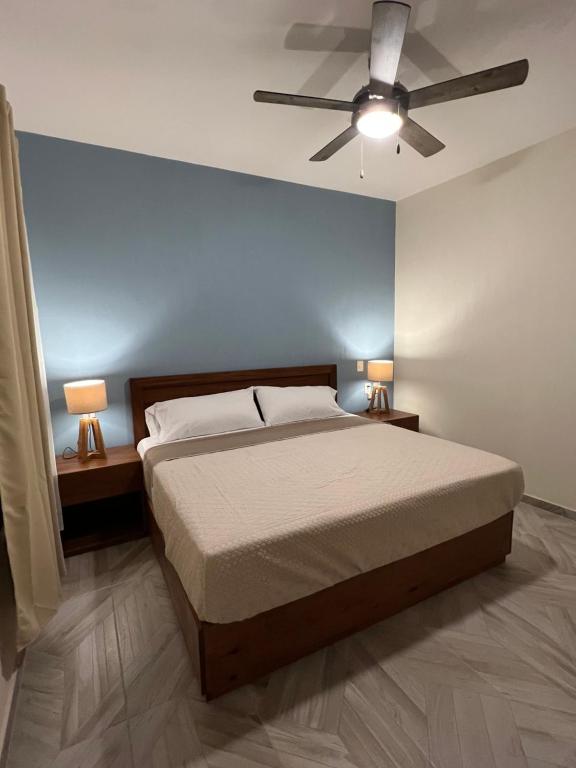 a bedroom with a bed and a ceiling fan at Casona 1530 in Tequila