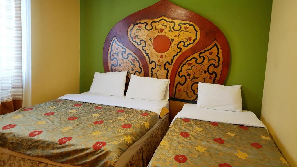 Postel nebo postele na pokoji v ubytování Elf Resort Hotel