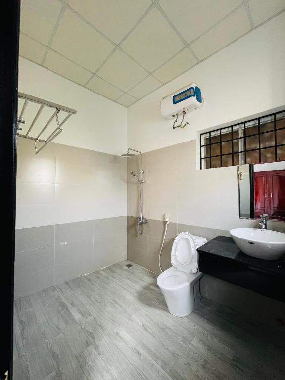 Giường trong phòng chung tại Full House Homestay