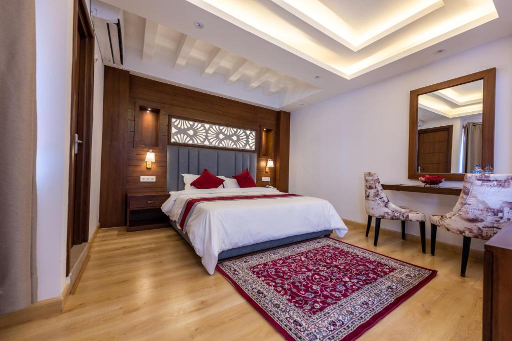 Postel nebo postele na pokoji v ubytování Hotel Ama-La, Thamel, Kathmandu