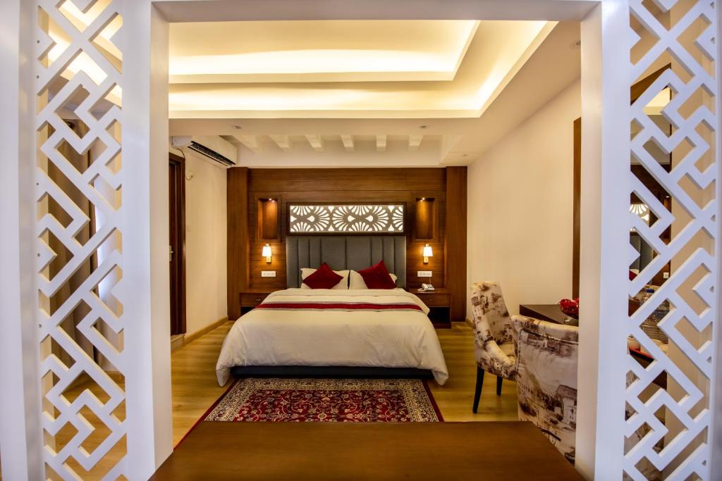 Postel nebo postele na pokoji v ubytování Hotel Ama-La, Thamel, Kathmandu