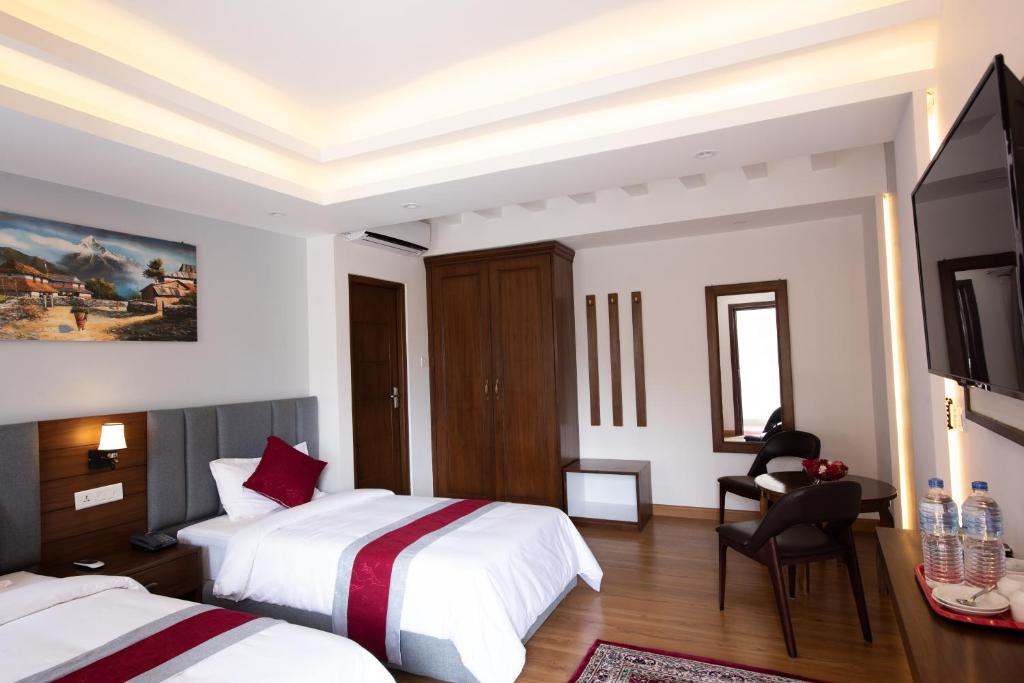 Postel nebo postele na pokoji v ubytování Hotel Ama-La, Thamel, Kathmandu