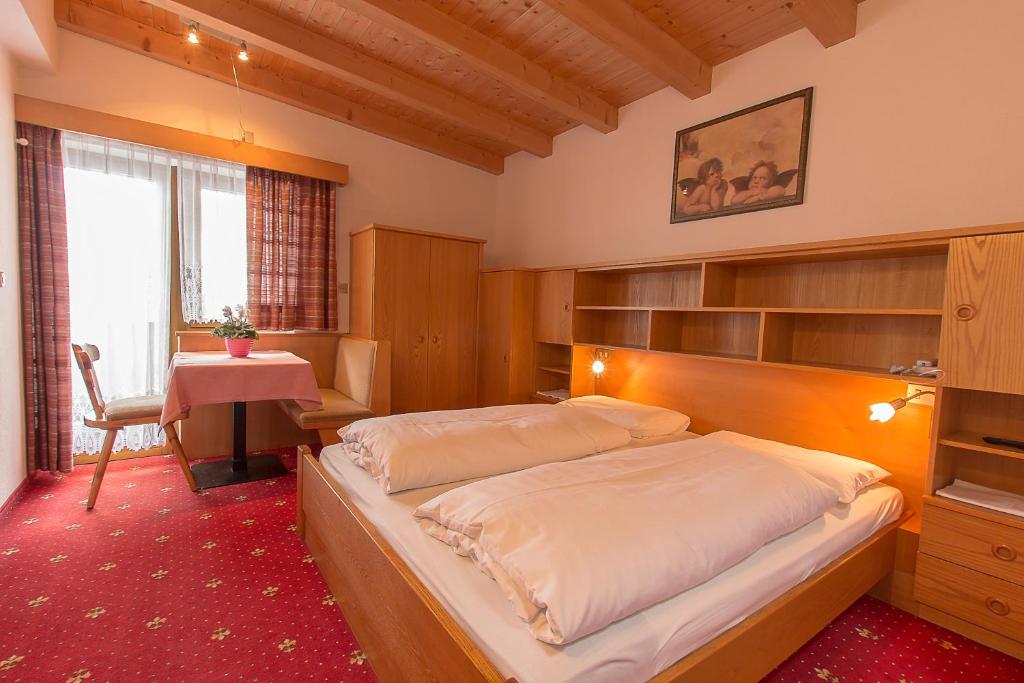 Postel nebo postele na pokoji v ubytování B&B Apartments La Palsa