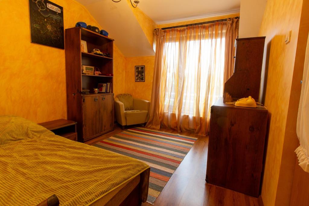Postel nebo postele na pokoji v ubytování Vila cu Mesteceni