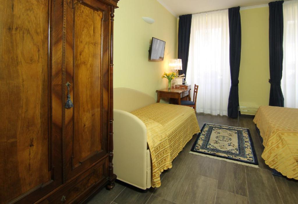 Postel nebo postele na pokoji v ubytování Albergo Al Viale