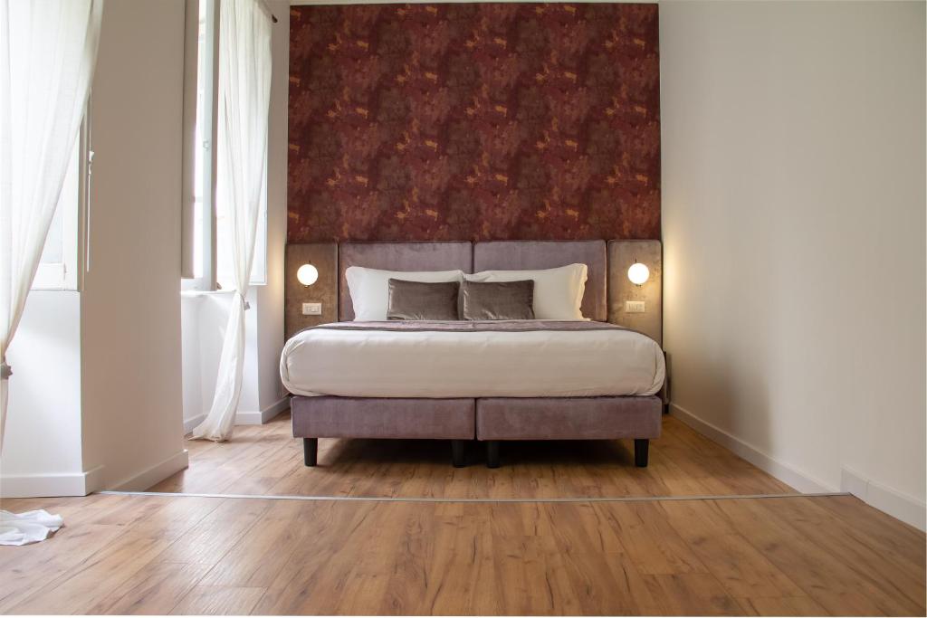 A bed or beds in a room at Home at Rome St. Peter Guest House