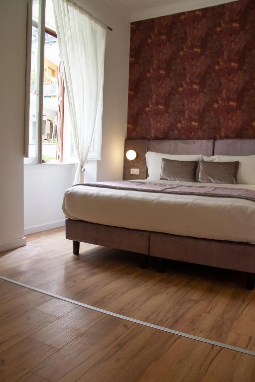 A bed or beds in a room at Home at Rome St. Peter Guest House
