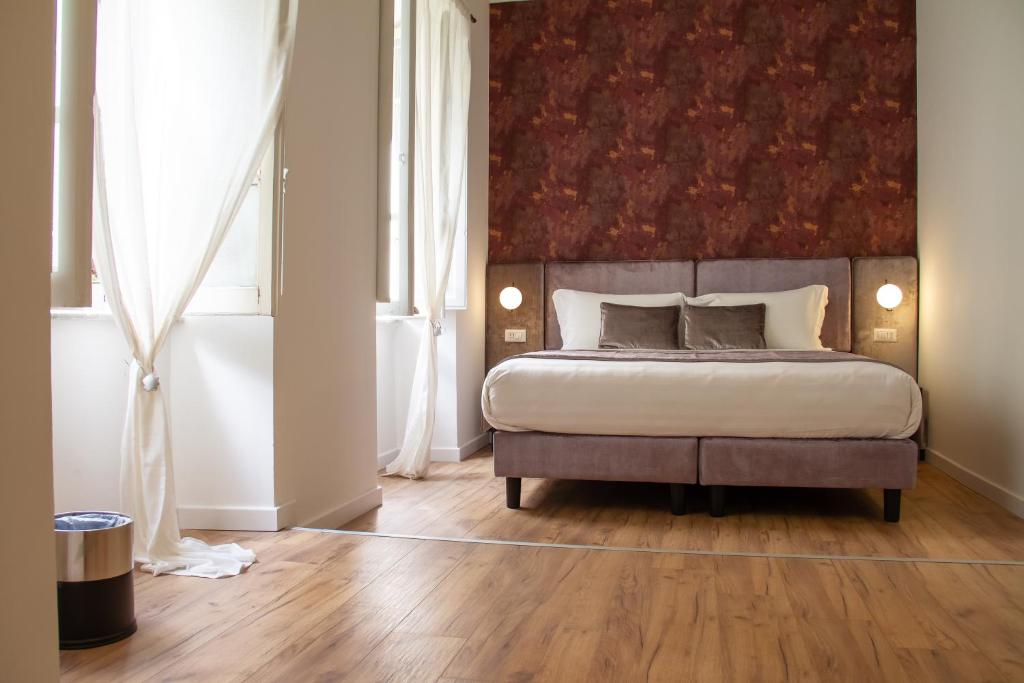 A bed or beds in a room at Home at Rome St. Peter Guest House