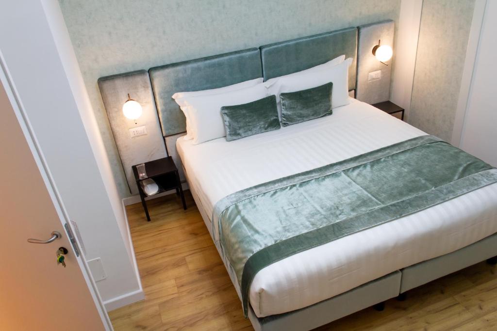 A bed or beds in a room at Home at Rome St. Peter Guest House