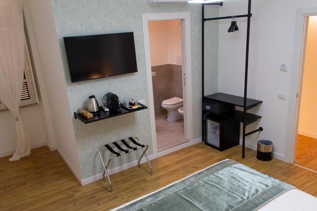 A television and/or entertainment centre at Home at Rome St. Peter Guest House