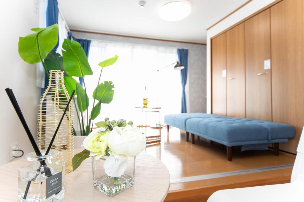 Postel nebo postele na pokoji v ubytování Yokkaichi Motomachi Hotel