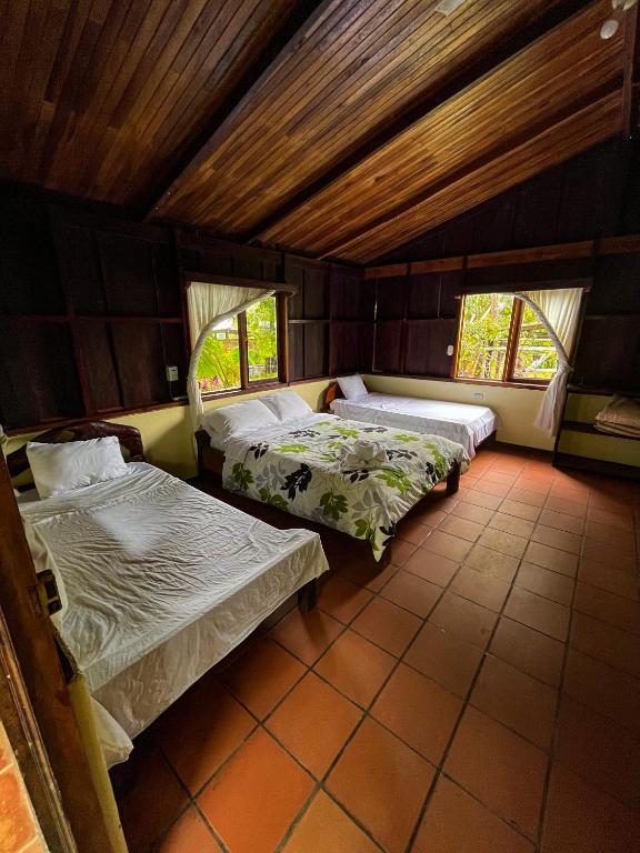 Postel nebo postele na pokoji v ubytování Princesa de la Luna Ecolodge