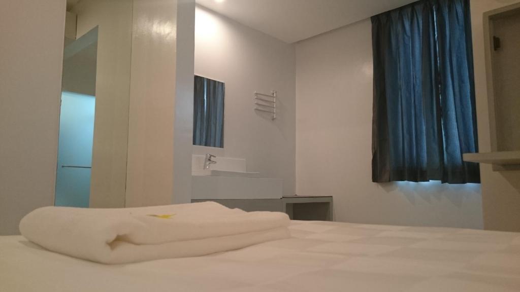 Postel nebo postele na pokoji v ubytování Go Hotels Butuan