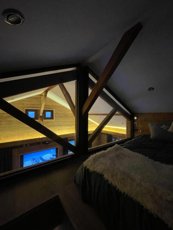 Postel nebo postele na pokoji v ubytování CHALET MONT BLANC