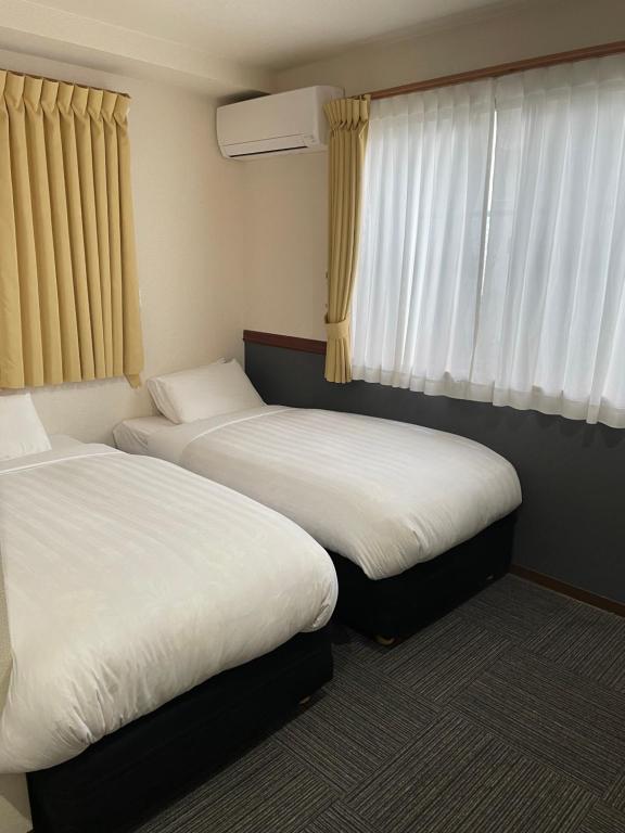 Postel nebo postele na pokoji v ubytování Karin doo Hotel