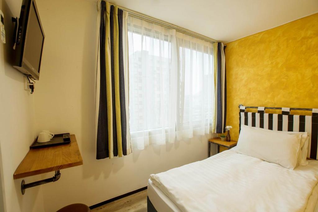 Letto o letti in una camera di Yesinn @YMT